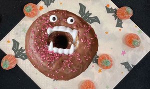 DIY Dracula Donut with candy pumpkins and Halloween decor