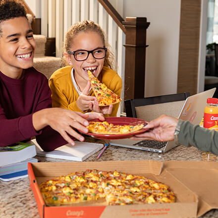 children eating Ultimate Breakfast Pizza