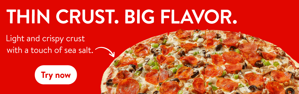 Thin crust pizza with pepperoni, sausage, olives, and green peppers, featuring a light and crispy crust