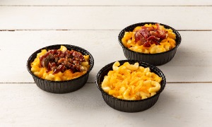 Bowls of Casey's Original, Brisket, and Bacon Mac and Cheese on table