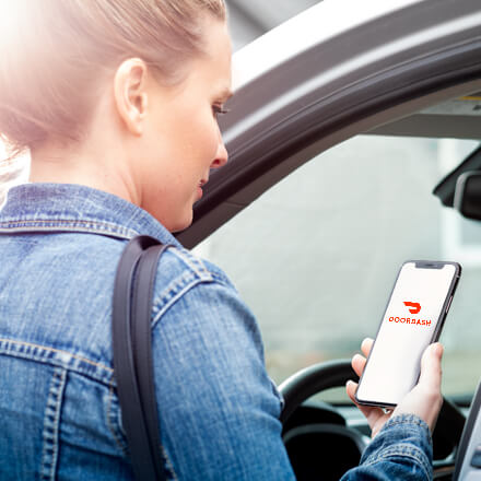 Person ordering grocery delivery on the DoorDash app
