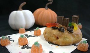 DIY Graveyard Donut with candy pumpkins and Halloween decor