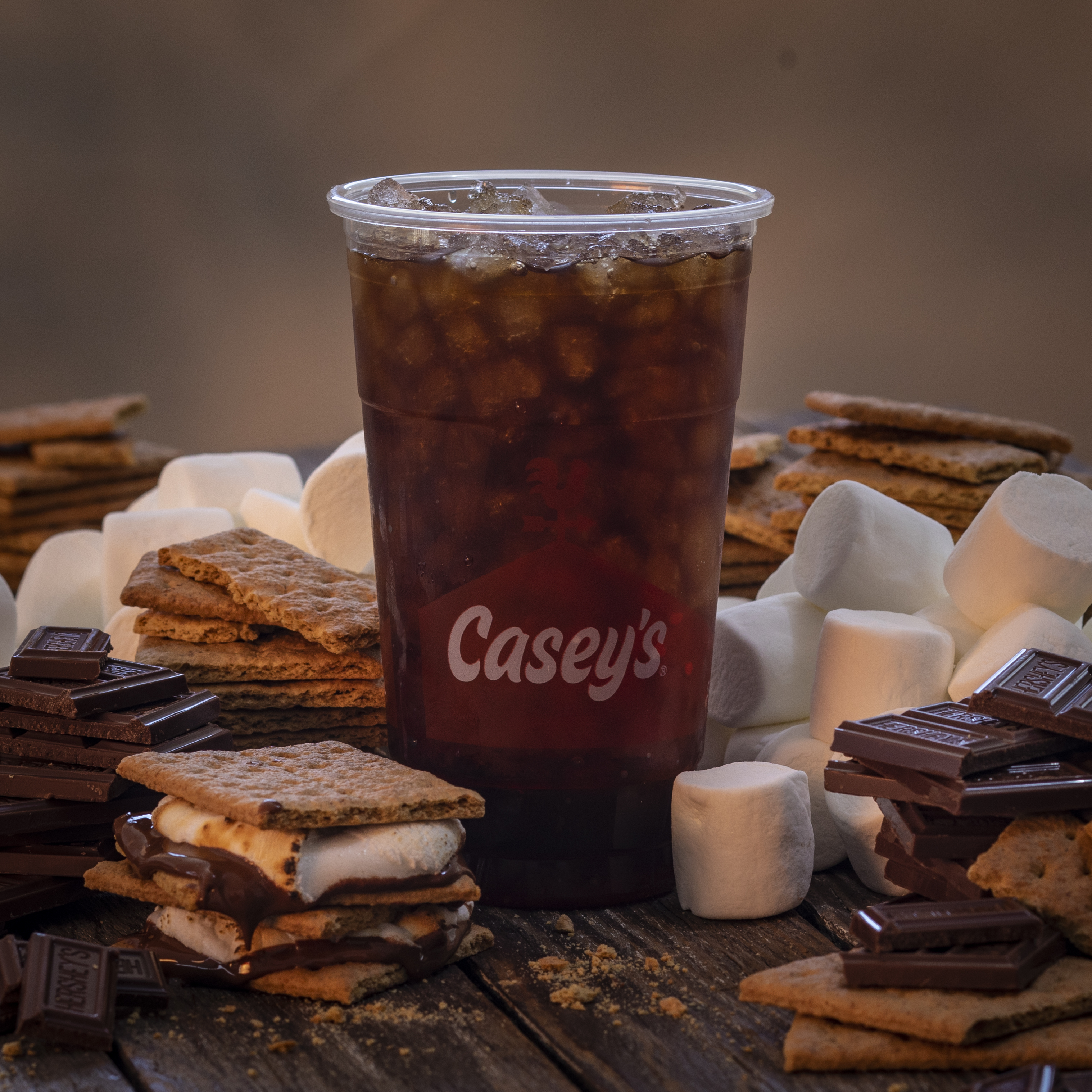 Casey's Iced S'mores Campfire Coffee with S'mores ingredients on a table