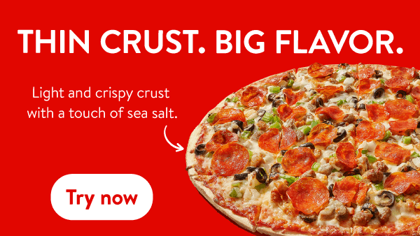 Thin crust pizza with pepperoni, sausage, olives, and green peppers, featuring a light and crispy crust