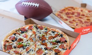 Casey's Supreme and Pepperoni Pizzas next to a football on a table