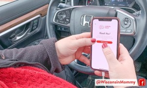 A woman ordering Casey's Curbside Pickup on her phone in her car
