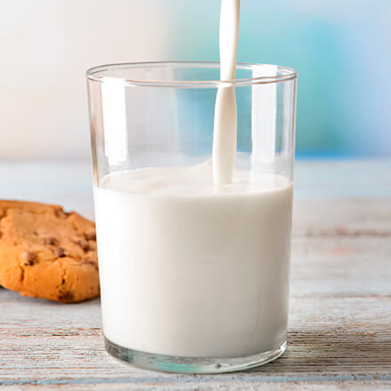 Glass of milk with cookies