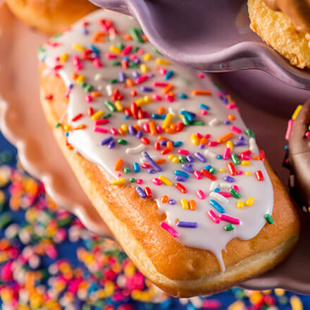 long john donut with sprinkles and white icing