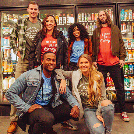 Casey's Merch: People wearing shirts in a Casey's store