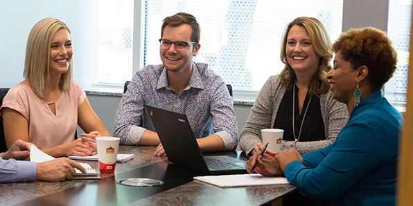 Team members working at a table