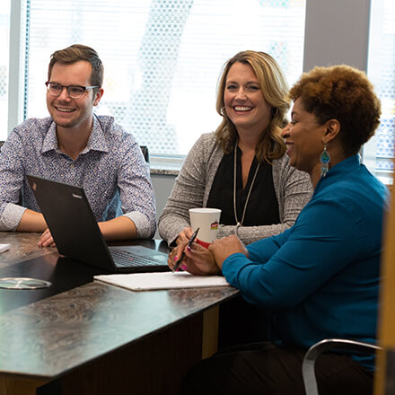 Team members working at a table