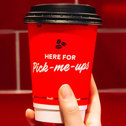 Coffee cup with Here for pick-me-ups on the side