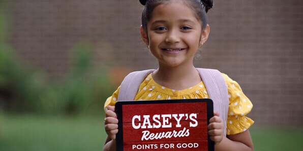 Child with Casey's Rewards Points for Good tablet