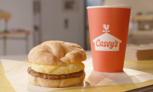 A Casey's Sausage, Egg & Cheese Croissant Breakfast Sandwich and a cup of coffee
